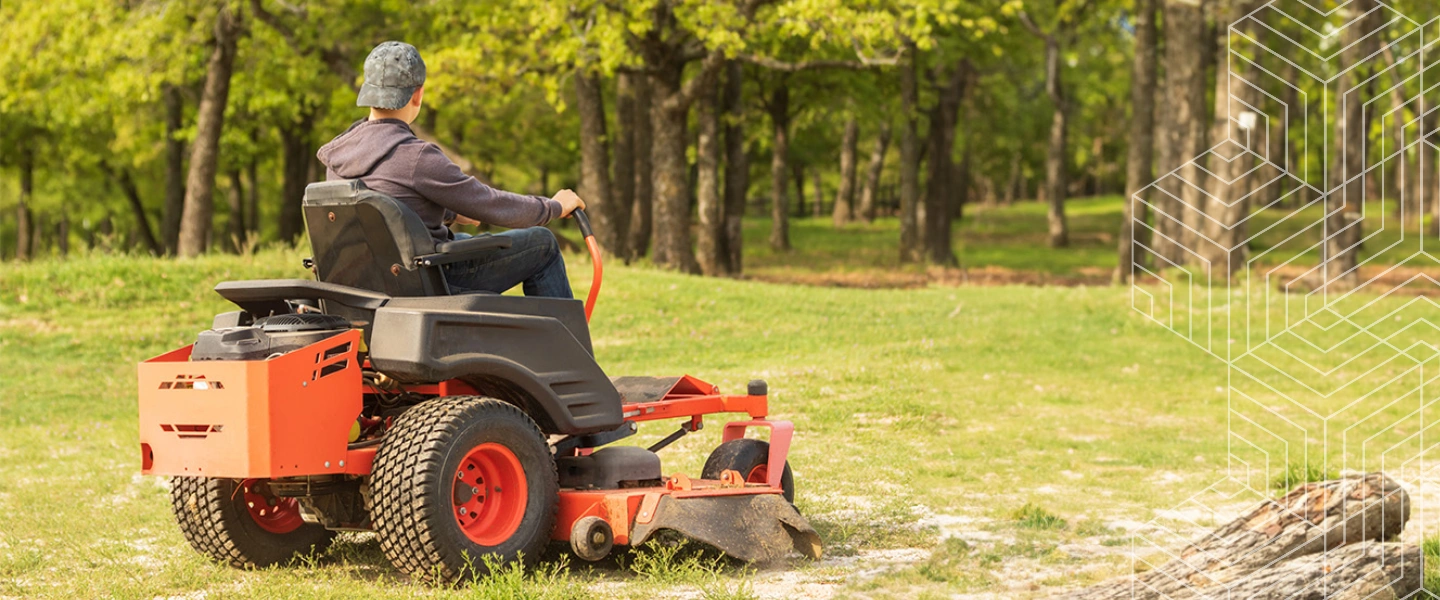 man on a commercial lawn mower